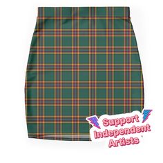 Super stretchy and durable polyester mini skirt. Vibrant, high-quality sublimation print across the front and back. Size range XXS-2XL. The Moran clan tartan is a classic plaid pattern in forest green and black, with bright gold, red, and royal blue accents. Moran families are found in County Leitrim and Mayo censuses; it is one of the most common surnames of people with Irish heritage in North America. Irish Plaid Skirt, Common Surnames, Irish Plaid, Irish Heritage, Plaid Mini Skirt, Bright Gold, Blue Accents, Skirts For Sale, Plaid Pattern