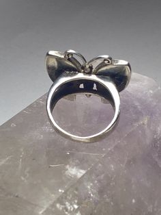 "Butterfly ring mother of pearl sterling silver women girls Size 6.75. Between a size 6.75 and a size 7 Length 7/8\" Width 1\" Thinnest 5/32\" Free Shipping & Free Postal Insurance Delivered in a Gift Box If you do not want the ring polished and want to leave the natural patina please let me know at the time of purchase as I do polish rings before I ship rings out. Thanks Free First Class shipping and postal insurance is included. If you want to upgrade to priority kindly pay an additional f Silver Ring For Formal Occasions And Mother's Day, Silver Ring For Formal Occasions On Mother's Day, Fine Jewelry Silver Hallmarked Moonstone Ring, Nickel-free Ring For Mother's Day, Vintage Adjustable Sterling Silver Butterfly Ring, Adjustable Vintage Sterling Silver Butterfly Ring, Silver Sterling Silver Pearl Ring With Polished Finish, Adjustable Fine Jewelry Opal Ring, Polished Finish Pearl Ring As Gift