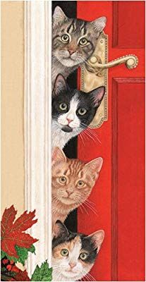 a group of cats peeking out from behind a red door with christmas decorations on it