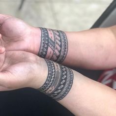 two people with wrist tattoos on their arms