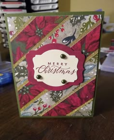 a christmas card with poinsettis on it