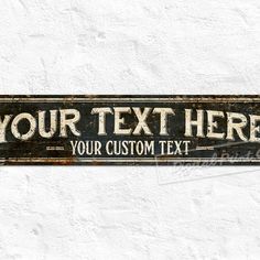 a sign that says, your text here is on the side of a white wall