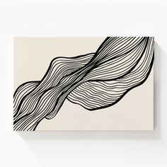 an abstract black and white painting on a wall