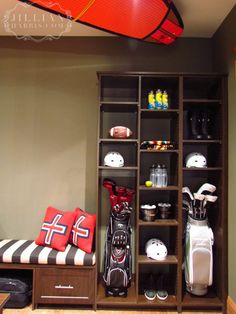 a room filled with different types of golf gear and accessories on shelves next to a bench