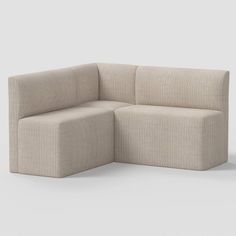 the corner sofa is made out of fabric and has two seats on each side, one with