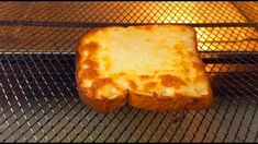 two pieces of bread sitting on top of an oven rack