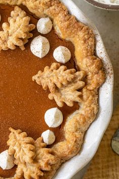 a pumpkin pie with marshmallows on top