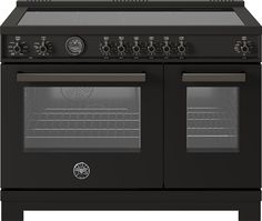 a black stove with two ovens and one door open