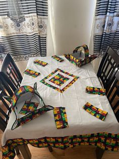 the table is covered with colorful placemats and napkins