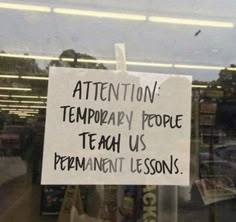 a sign posted in the window of a store stating it is temporary people teach us permanentment lessons