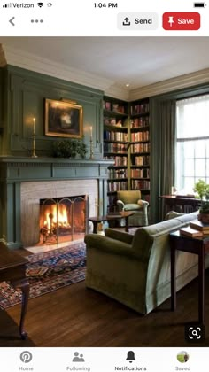 a living room filled with furniture and a fire place in the middle of a room