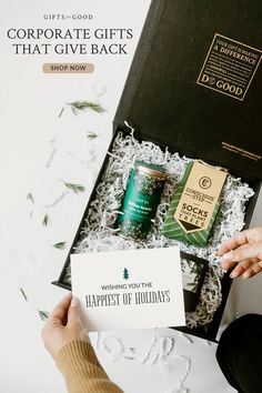 someone is holding up a gift box that says, corporate gifts that give back shop now