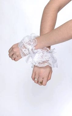 Get that eccentric Victorian look with these cuffs. Made with delicate white lace frills, these wrist cuffs will add a touch of elegance and charm to your outfit.