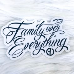 a sticker that says family over everything on it, with the words above it