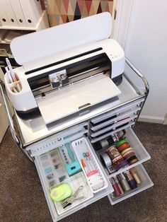 the sewing machine is open and ready to be put in it's storage compartment