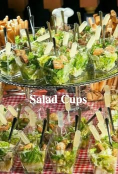 salad cups are stacked on top of each other and ready to be served at an event