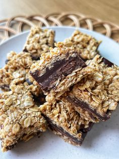 some granola bars are stacked on a plate