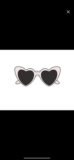 a pair of heart shaped sunglasses sitting on top of a black and white background