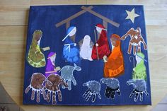 an art project made out of handprints of the nativity scene