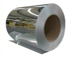 rolls of aluminum foil are stacked on top of each other in an assembly line,