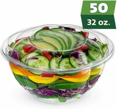 a bowl filled with sliced cucumbers and red cabbage