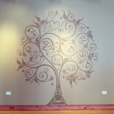 a wall with a tree painted on it