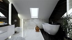 a white bath tub sitting under a window next to a sink in a black and white bathroom