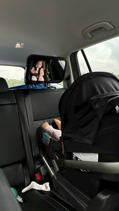 two children in the back seat of a car