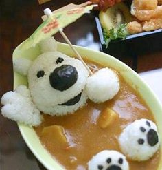 a bowl filled with soup and stuffed animals