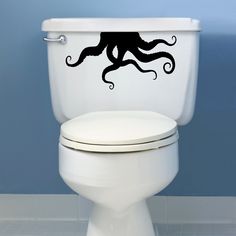 an octopus sticker on the side of a toilet