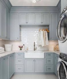 a washer, dryer and cabinets in a kitchen