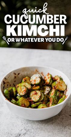 a white bowl filled with brussel sprouts on top of a table