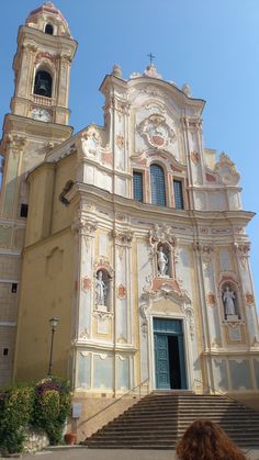 an old church with stairs leading up to it