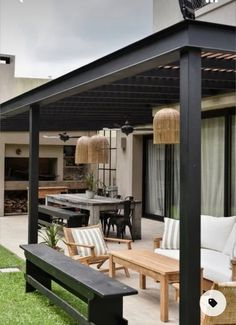 an outdoor living area with patio furniture and table