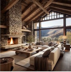 a living room filled with furniture and a fire place in the middle of a room