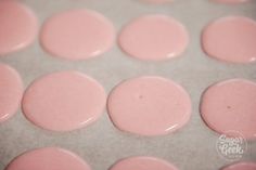 some pink circles are on a baking sheet