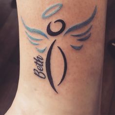 a woman's foot with a tattoo on it that reads dear and an angel