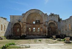 an old building with stone arches and windows