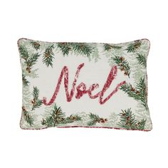 a christmas pillow with the word noel written in red and green pine branches on it