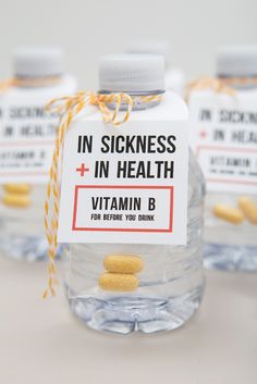 three bottles with vitamins in them sitting on a table