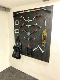 there are many tools hanging on the wall