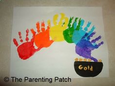 a child's hand and foot print with the word gold painted on it in rainbow colors