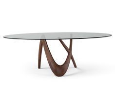 an oval glass table with wooden legs and a curved design on the top, against a white background