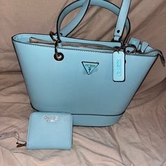 Pretty Powder Blue Guess Purse With Matching Wallet Brand New. Blue Rectangular Bag With Interior Card Slots, Blue Pouch Wallet With Zipper Closure, Blue Everyday Bag With Interior Card Slots, Blue Bags With Interior Card Slots For Everyday Use, Blue Bag With Interior Card Slots For Everyday Use, Blue Shoulder Bag With Card Slots For Everyday Use, Everyday Blue Shoulder Bag With Card Slots, Trendy Blue Wallets With Interior Card Slots, Trendy Blue Wallets With Card Slots