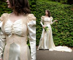 a woman in a white dress standing next to bushes