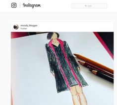 a drawing of a woman's dress on top of a piece of paper with pencils next to it