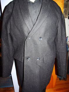 This is a very sharp Calvin Klein Peacoat. It looks new. Two inside pockets that button. The lining is 100% Polyester. There are two outer pockets. It is double breasted, with two buttons on each side. It is black with speckled beads of color sewn in.  Shoulder: 19" Pit: 23" Length: 36" Sleeve: 20" Calvin Klein Fitted Blazer For Formal Occasions, Calvin Klein Single Breasted Formal Blazer, Calvin Klein Formal Single-breasted Blazer, Calvin Klein Tailored Notch Lapel Outerwear, Calvin Klein Classic Long-sleeve Suits, Fitted Calvin Klein Semi-formal Outerwear, Fitted Calvin Klein Outerwear For Semi-formal Occasions, Elegant Calvin Klein Outerwear For Semi-formal Occasions, Elegant Calvin Klein Semi-formal Outerwear