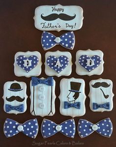 decorated cookies are arranged in the shape of bow ties and mustaches for father's day