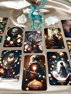 a collection of tarot cards sitting on top of a table