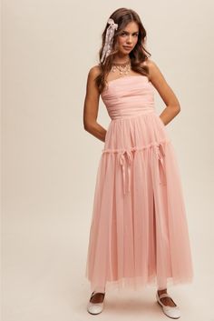 Get ready to turn heads in the Aurelie Rose Pink Ruched Tulle Maxi Dress. This unique and flirty dress features a stunning ruched tulle design that will make you stand out in any crowd. The delicate pink color adds a touch of romance, making it perfect for any special occasion. Embrace your playful side with this one-of-a-kind dress. Ruched mesh Bodice Adjustable Straps Smocked Back Velvet Bows Detail On Skirt Double Layered Tulle Skirt Velvet Bows, Tulle Maxi Dress, Layered Tulle Skirt, Flirty Dresses, Velvet Bow, New Arrival Dress, Rose Pink, Pink Rose, Pink Roses